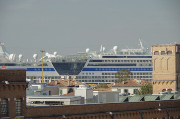 Fototapeta na wymiar Modern German club cruiseship cruise ship liner Bella in port of Venice, Italy