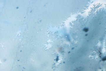 Close Up of Window With Snow Flakes