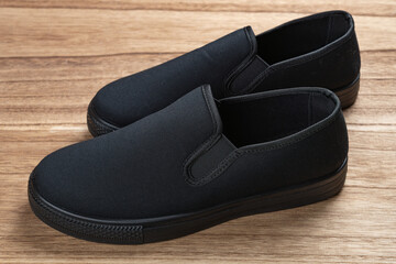 pair of black sneakers for men