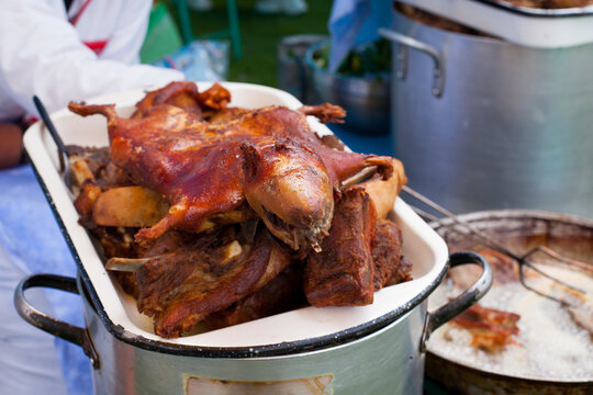 Forography of fried guinea pig in a local fair in Peru. Concept of Peruvian food and traditions.