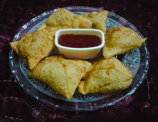 Samosas with tomato sauce in the Plate - Alo Samosa with Red Chutney - Samosa with Ketchup