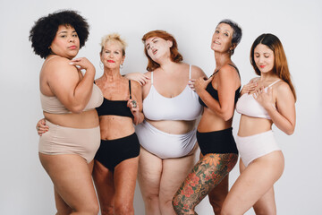 women of different ethnicities, self love and acceptance, posing in underwear on white background