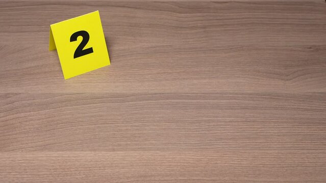 Crime Scene Investigation - forensic officer puts up a gun as a piece of evidence