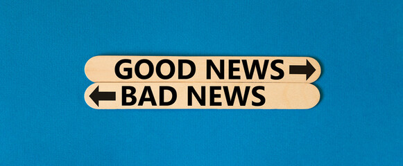 Good or bad news symbol. Concept word Good news Bad news on beautiful wooden stick. Beautiful blue...