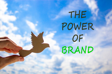 The power of brand symbol. Concept words The power of brand. Beautiful blue sky cloud background....
