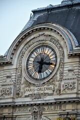 Paris, France 04.23.2017: Clock on the facade of the current Musée d'Orsay of Paris - obrazy, fototapety, plakaty