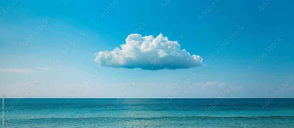 Wall mural blue cloud floating above the sea