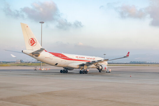 Algiers, Algeria - October 3, 2023: Airbus A330-200 with red airplane logo algerian brandmark Flight Company Air algerie parked on the tarmac outside in the Houari Boumediene airport in Algiers