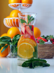 Detox Water with Orange, Strawberry, and Mint