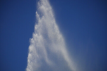 high water fountain in blue sky