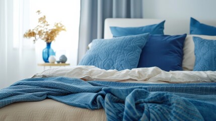  Modern bedroom, bed with blue blankets and blue pillows