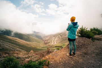 tourist on the Road leading towards the Salinas Grandes salt flats near Purmamarca