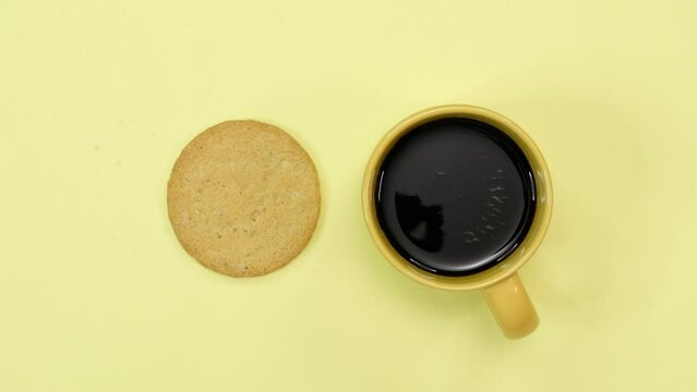 Animated coffee and cookies on yellow background
