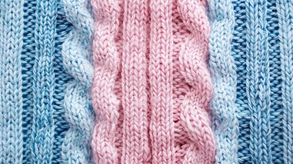 Pastel pink and blue knitted sweater texture background.