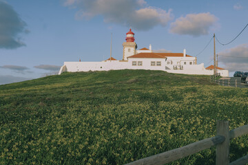 Fototapeta na wymiar As the westernmost lighthouse in Europe,the Cabo da Roca lighthouse symbolizes both navigation safety and the untamed beauty of the continent's edge where land meets the vastness of the Atlantic Ocean