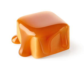 One sweet caramel candy cube topped with caramel sauce on white background - 753723405