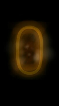 Vertical looping number counting animation from zero to nine with glowing orange digits on a black background.