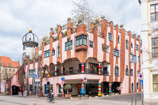 Green citadel by the artist and architect Friedensreich Hundertwasser on a cloudy day, Magdeburg, Saxony-Anhalt, Germany 