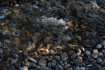 beautiful stones near a mountain river in the French Alps