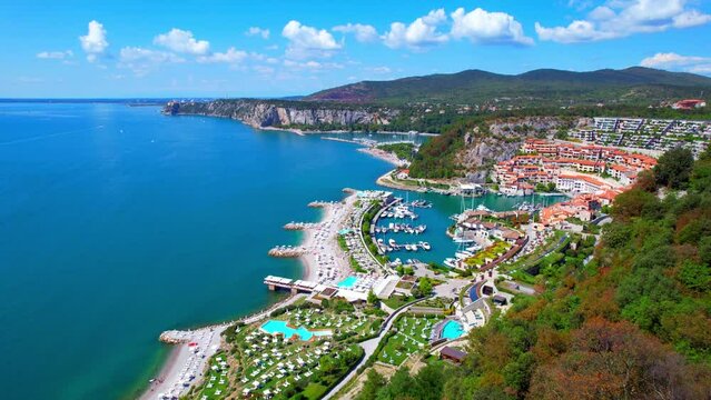 Portopiccolo Sistiana - Italy - Gulf of Trieste - fantastic flight aerial view of the seaside resort with marina in a rocky bay