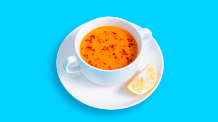 Lentil soup bowl isolated on blue