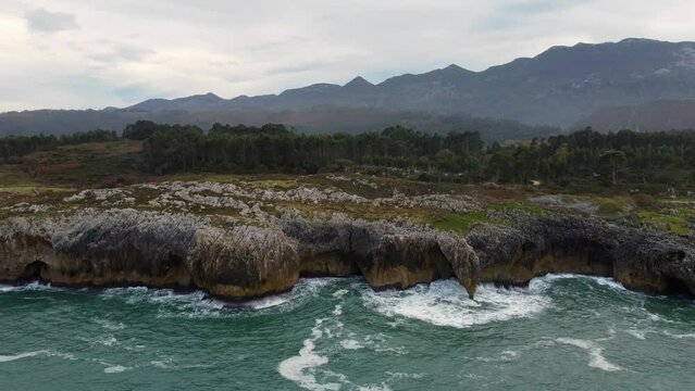 Aerial view coast with cliffs in Llanes, Asturias. Spain. Mouth of the Puron river.