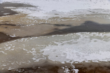 frozen lake in winter in cloudy weather, ice on the lake ts