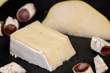 delicious sliced cheese with edible white mold
