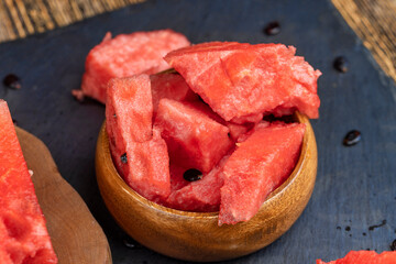 sliced into pieces of red ripe watermelon