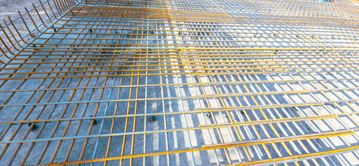 A metal grid is seen in the sunlight
