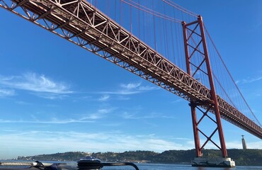 under the 25 April Bridge in lisbon