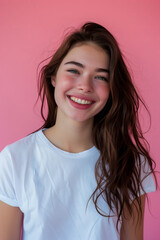 Fototapeta premium Caucasian woman wearing t-shirt on pink background.