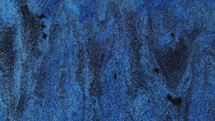 Liquid paint background. Smooth flow. Blue grey black dye mix abstract creative waves with glitter...