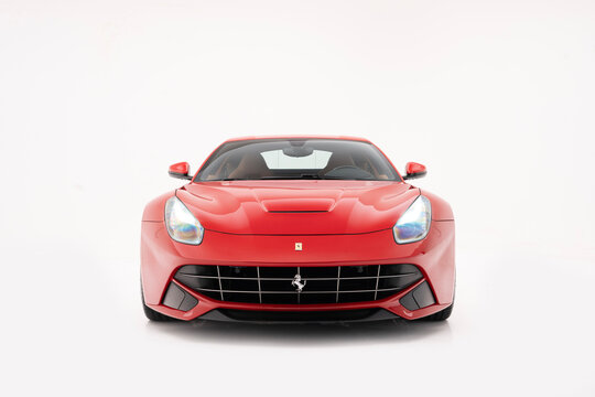 Red Ferrari F12 Berlinetta front view isolated on white background  - High Resolution Studio Image