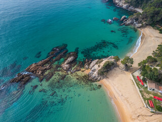 Fototapeta premium Santa Cristina beach in Lloret de Mar and Blanes Cala Treual Capture the essence of Spain's coastal charm with aerial images showcasing the stunning vistas of Blanes and the bustling energy of Lloret 