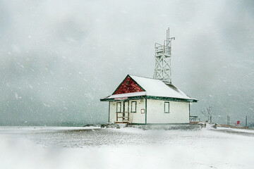 Winter snow storm on beach with wooden heritage lifeguard station shot on kew beach Toronto room for text