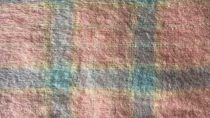 Mohair. Pink wool mohair scarf with fringe. warm knitted blanket with pink and blue geometric pattern. Texture wool