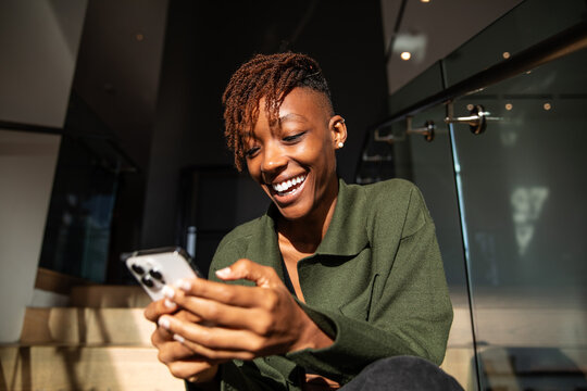 Adult Woman Radiates While Using Smart Phone 