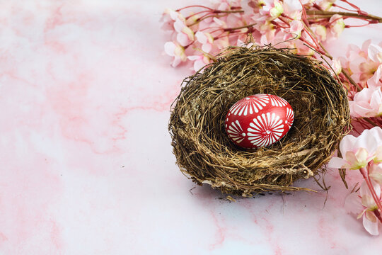 Red Easter egg on marble background. Happy Easter