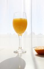 glass of orange juice and fruits