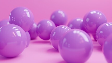 a group of purple balls sitting on top of a pink surface with a pink wall in the backround.