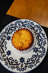 coconut pie on a plate decorated in blue