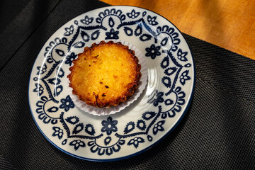 coconut pie on a plate decorated in blue