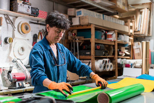 Mature female worker doing precision cut work