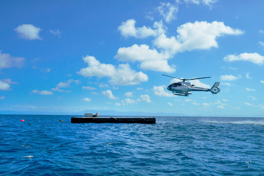 Fototapeta Helicopter landing at Great Reef for joy flight over the reef
