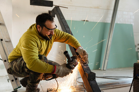 Man processes the supporting structure for the stairs