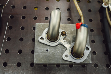 Welded production of external wastegate manifold from stainless steel, exhaust manifolds in a...