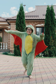 Teenager Dressed As A Dinosaur For Halloween