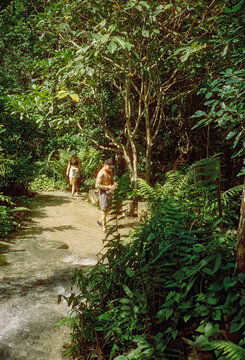 Young travellers exploring a tufa waterfall in Northern Thailand.