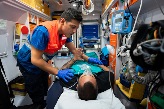 paramedic attending to a patient in an ambulance